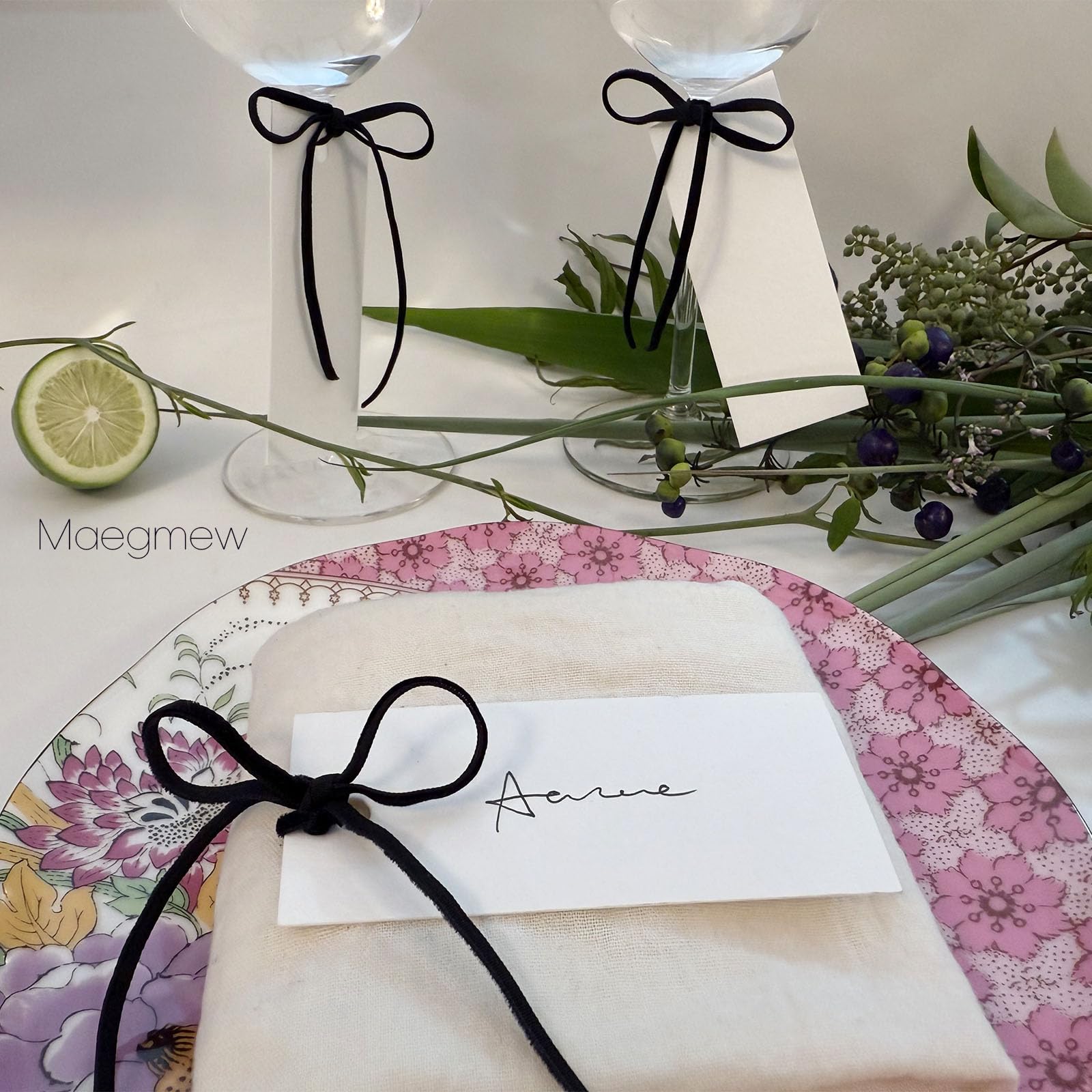 Maegmew seating card collection arranged for event planning.