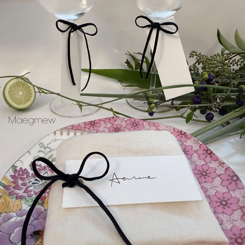 Maegmew seating card collection arranged for event planning.