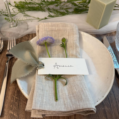 Maegmew table name cards setup for a polished wedding reception