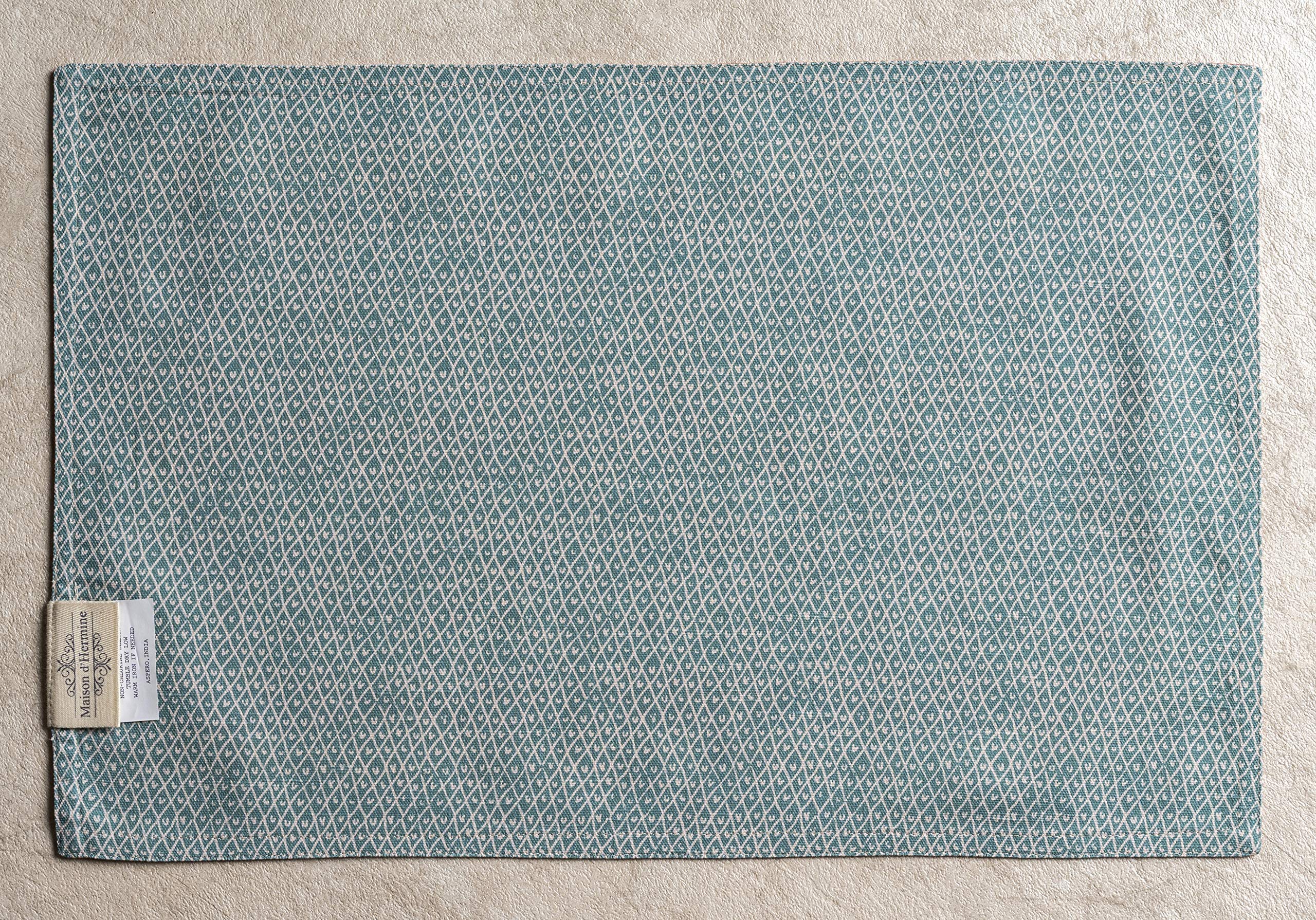 European motif prints on Maison d'Hermine placemat for elegant dining ambiance.