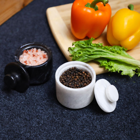 Marble Hives stylish salt bowl with lid keeps herbs and spices at hand.