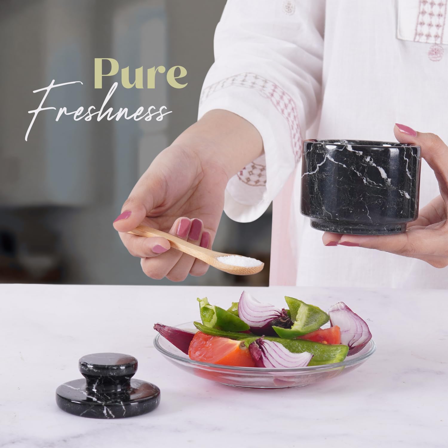 Black zebra marble dish with lid elevates counters while keeping spices fresh.