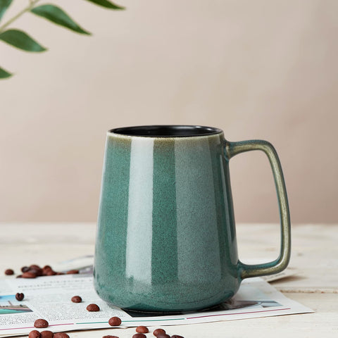 Masoline 24 oz mug reactive glaze close-up reveals temperature-inspired color shifts.
