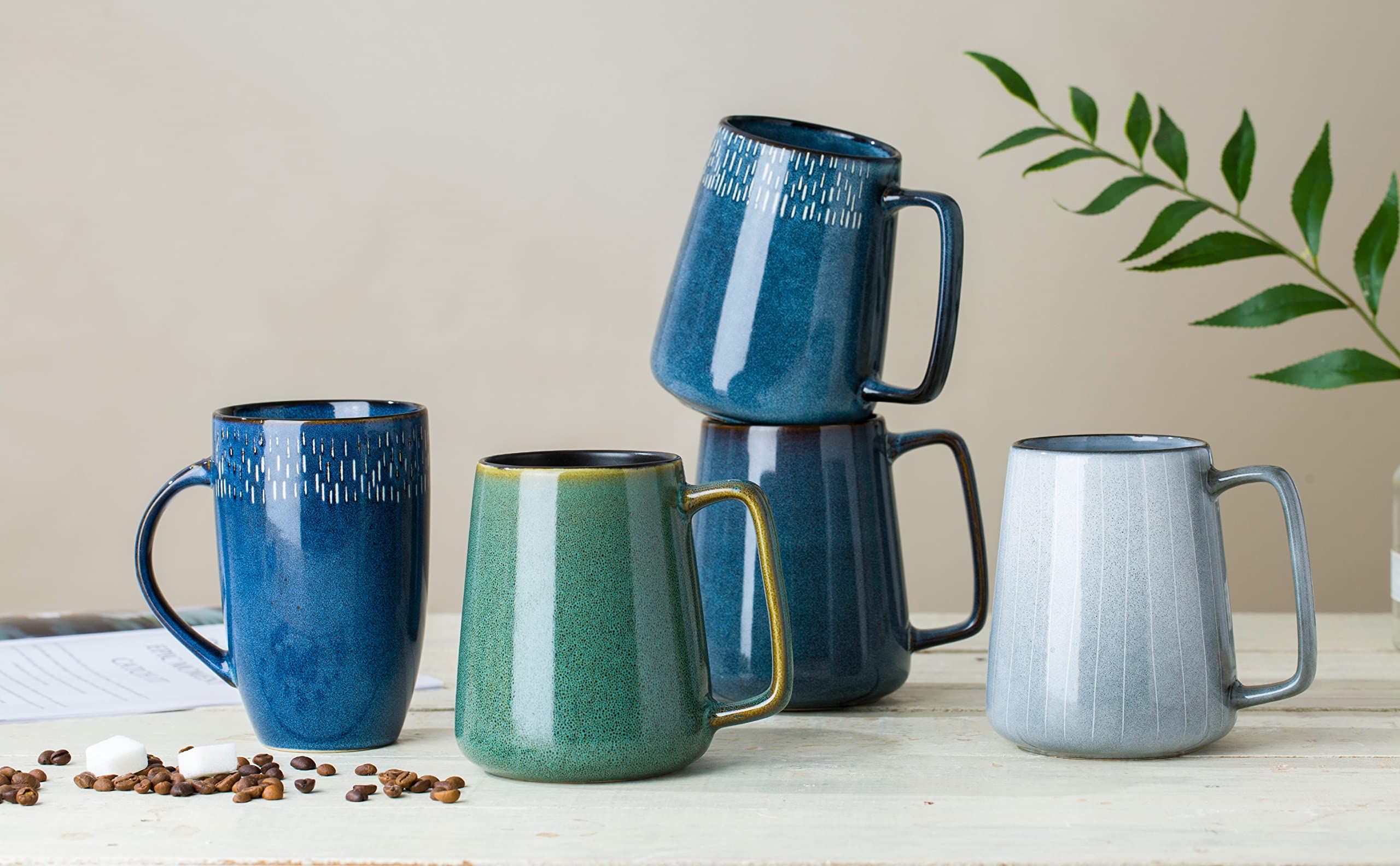 Masoline 24 oz mug in use on a desk demonstrates versatile home and office use.