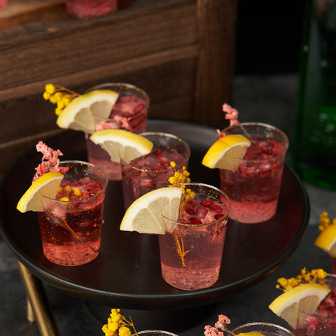 MATANA 200 Gold Glitter Shot Glasses on table evoke festive elegance.