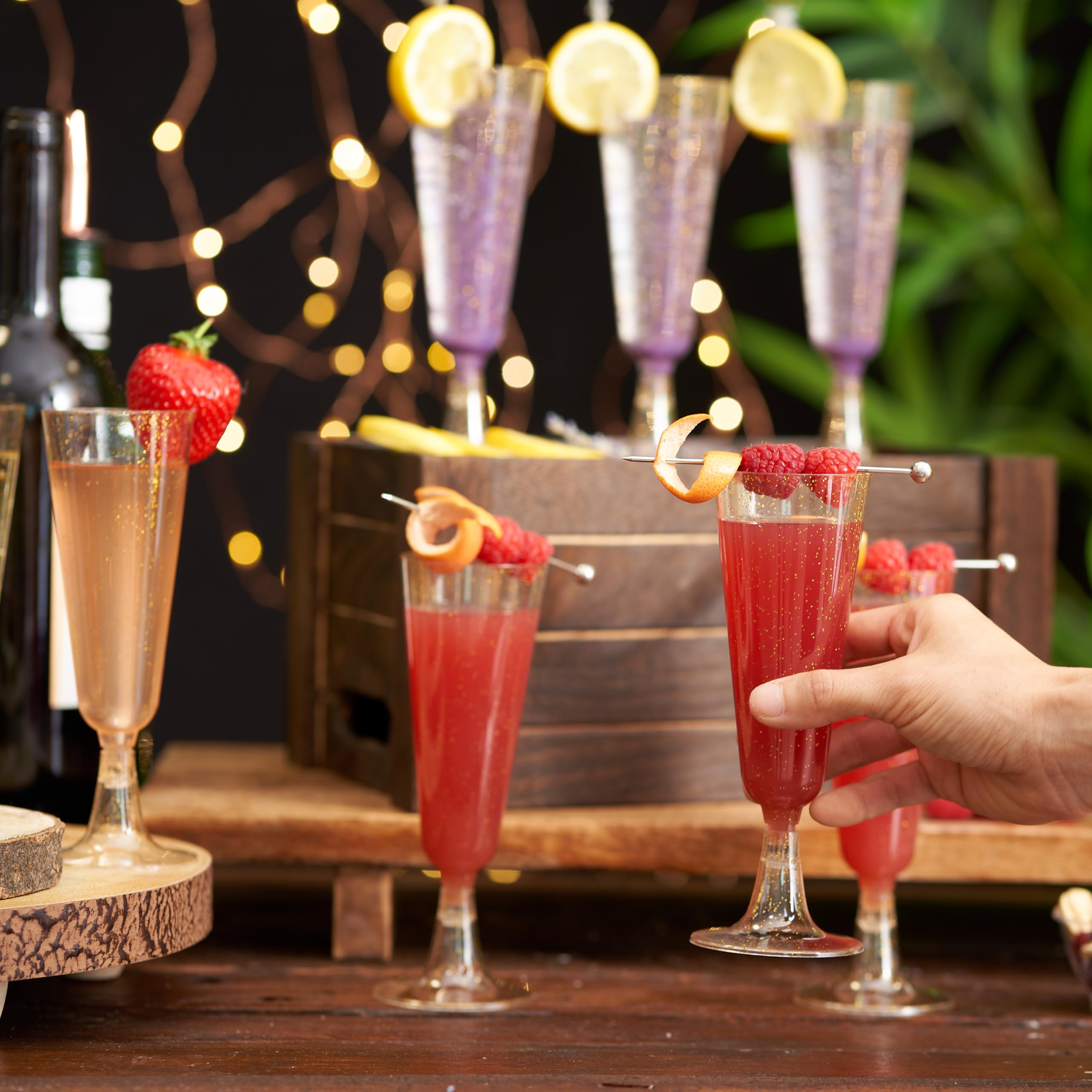 Outdoor event setup with Matana gold glitter flutes.