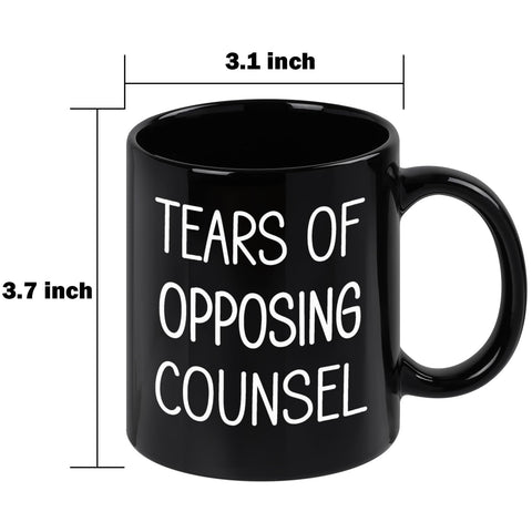 Maustic Tears of Opposing Counsel mug photographed with coffee on a desk.
