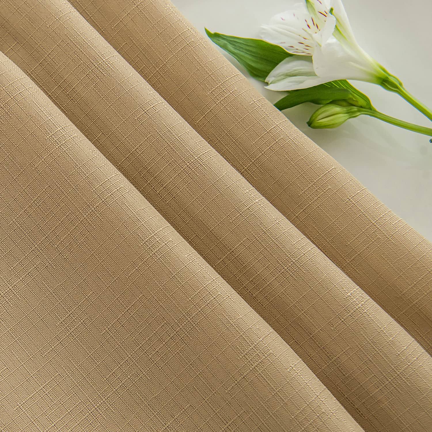 Patio dining setup featuring a Maxmill beige faux linen tablecloth.