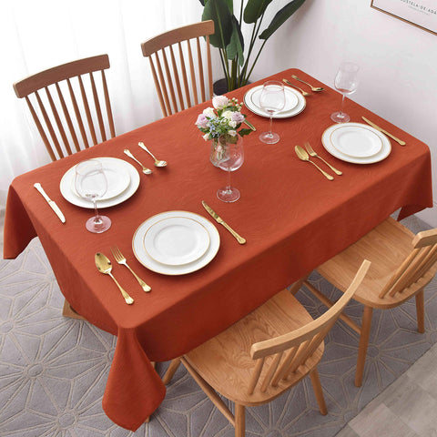 Maxmill Jacquard Swirl Rust tablecloth close-up shows premium weave and spill-ready finish
