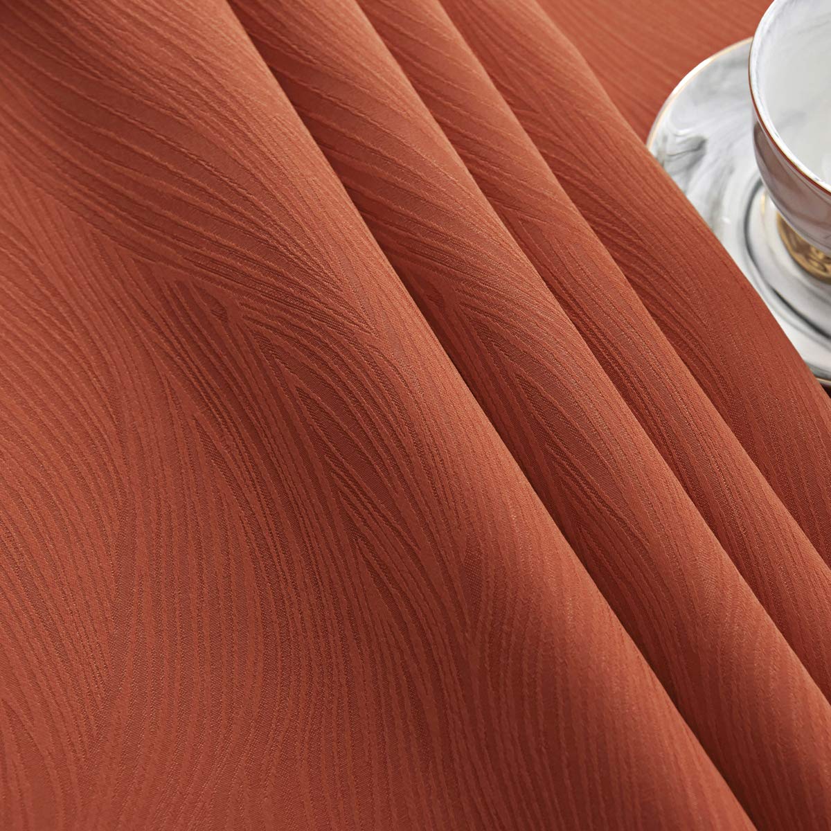 Maxmill Jacquard Swirl Rust tablecloth care and washing tips shown