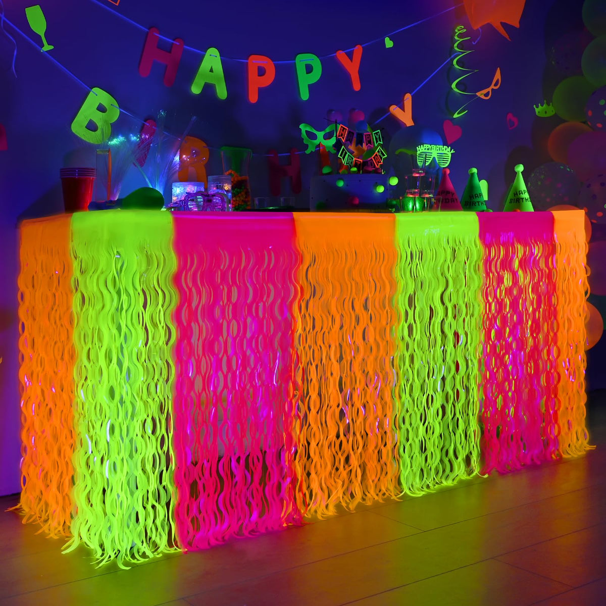 Mega-L Glow neon table skirt in orange glows to brighten neon party décor.