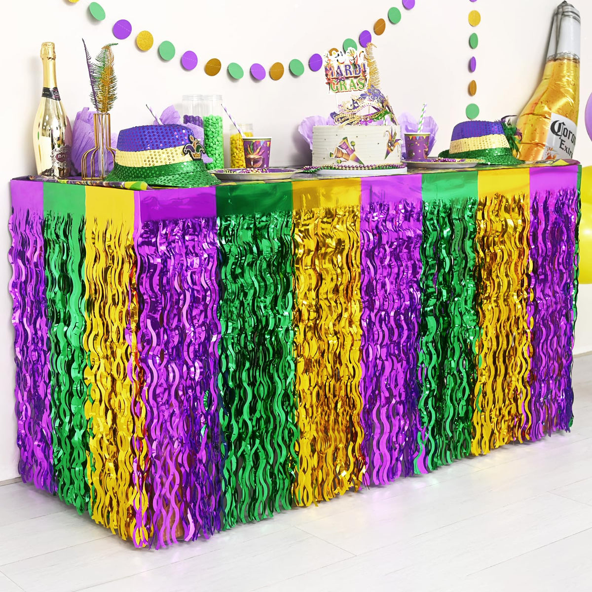 Mega-Loopolis Mardi Gras foil fringe table skirt adds sparkling centerpiece for rectangular or round tables.