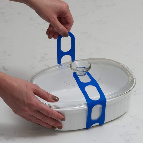 Mella Lid Latch travel ready strap sealing a dish lid at an event