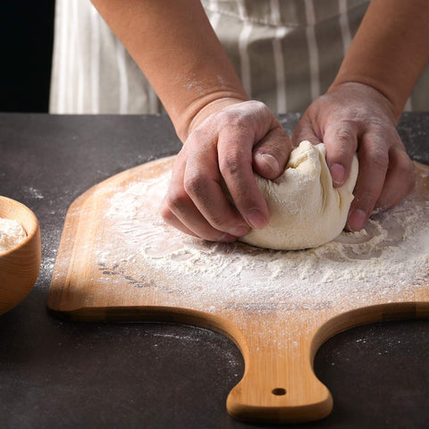 Bread slicing and serving made easy with the dual-sided bamboo board.
