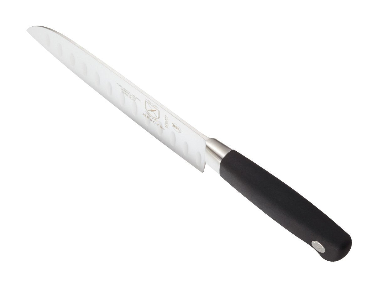 Mercer Genesis 7-Inch Santoku knife in use for chopping tasks in kitchen