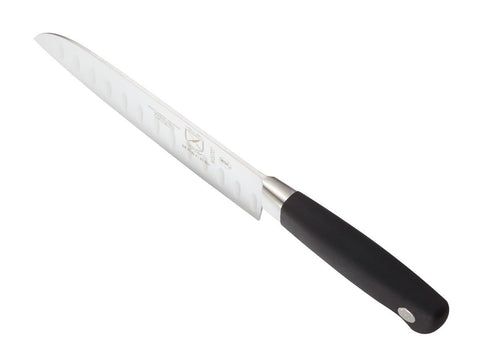 Mercer Genesis 7-Inch Santoku knife in use for chopping tasks in kitchen