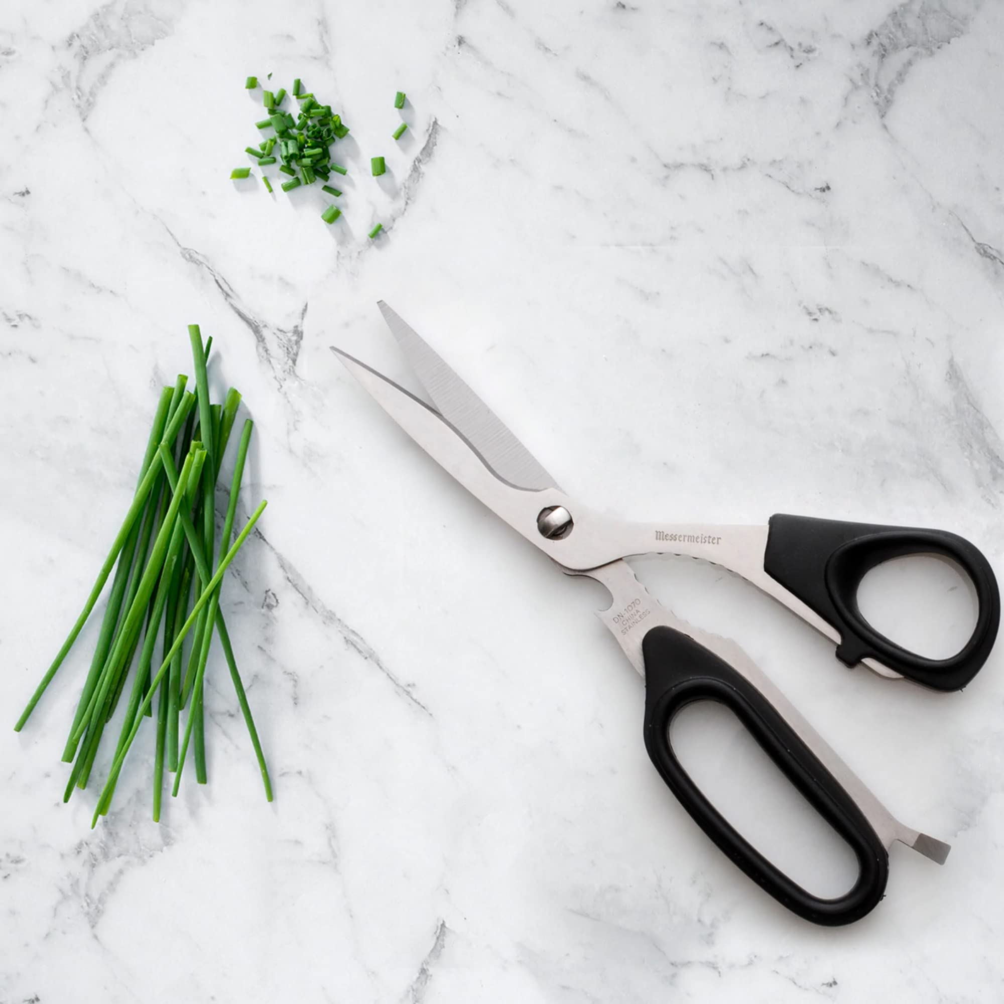 Messermeister bone and twig cutter enables clean trimming during prep.