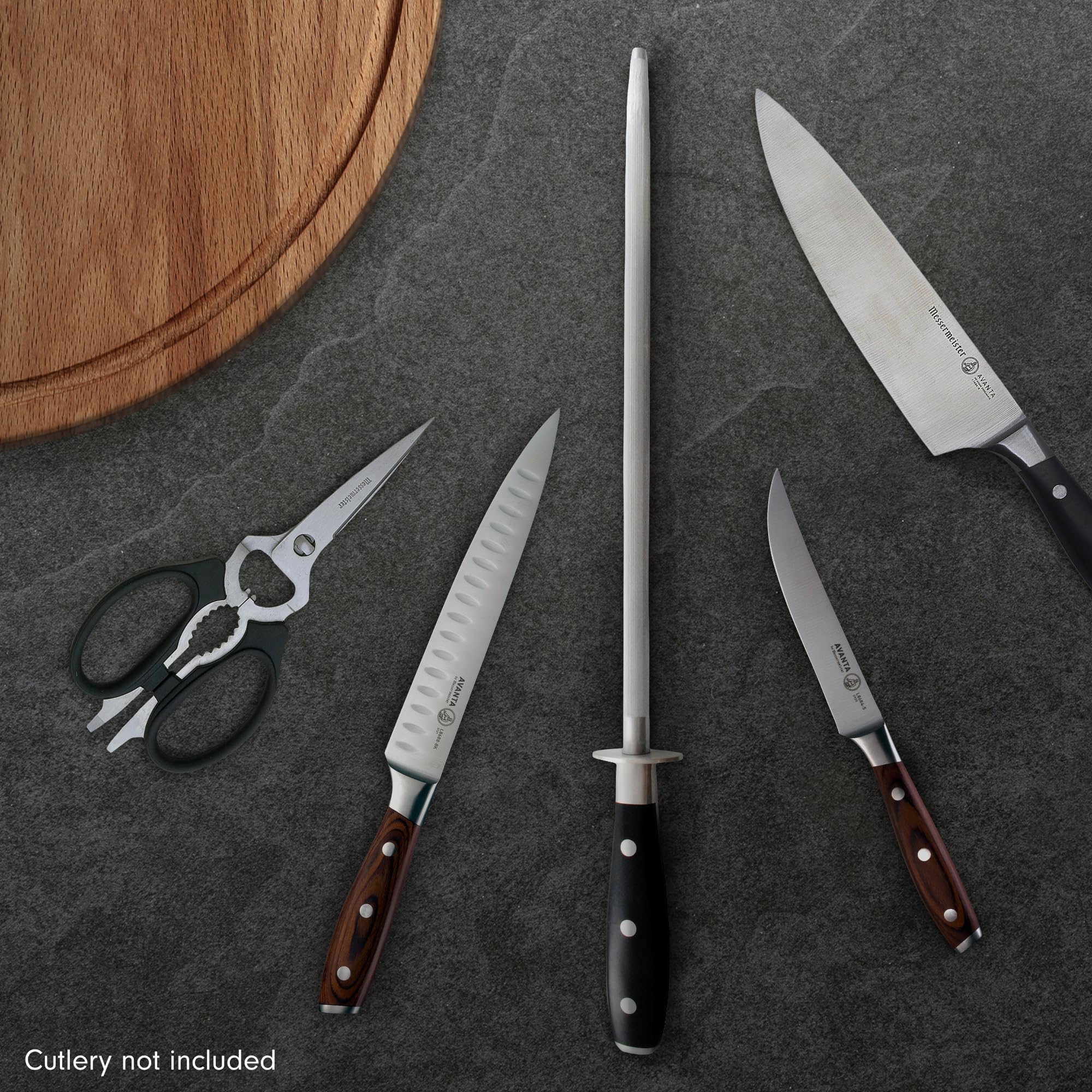 Messermeister sharpening rod in use on kitchen knives for precision