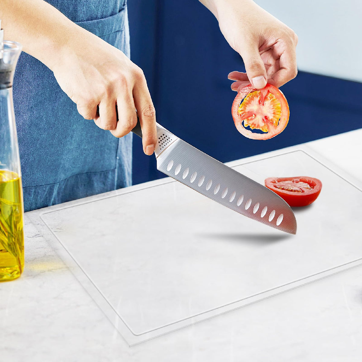 MEWSDEN acrylic cutting board with juice groove keeps counters clean during prep.