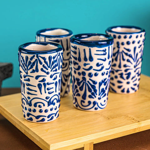 Hand-painted MEXTEQUIL Talavera glass, blue lace pattern, perfect for tequila rituals.