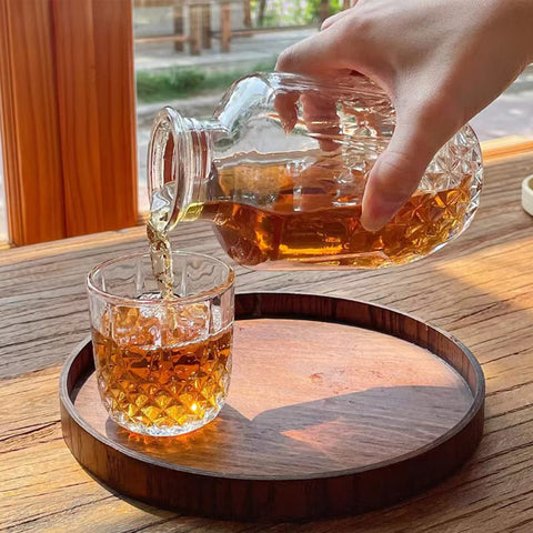 Mfacoy multi-use decanter suitable for beverages or mouthwash on bathroom counter.