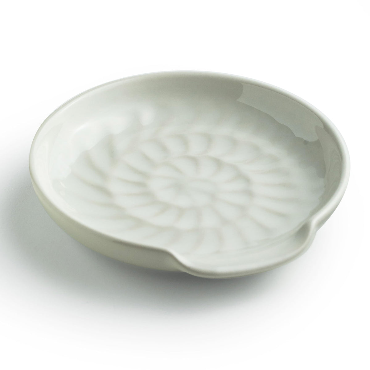 Miamolo spoon rest on stove top, white ceramic keeps counters tidy