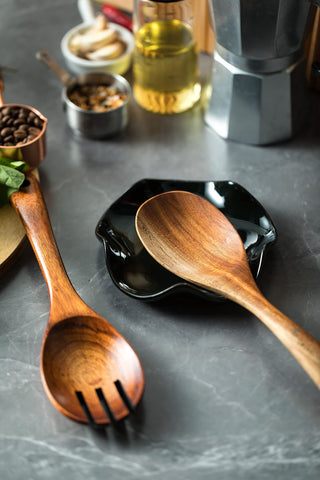 Miamolo spoon rest doubles as utensil holder for spatulas and tongs.