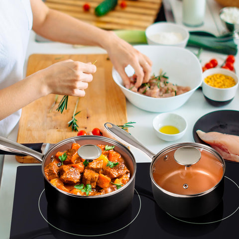 Michelangelo copper sauce pan ergonomic handle detail for comfortable grip.