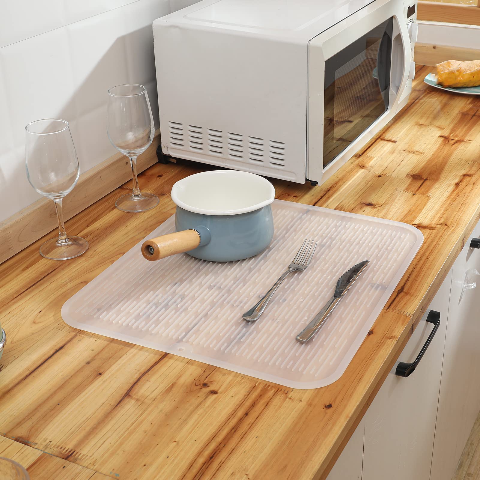 MicoYang silicone drying mat cleans easily by rinsing or brushing.