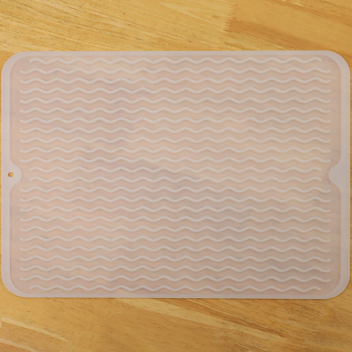 MicoYang silicone drying mat on kitchen counter keeps dishes organized while drying.