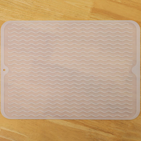 MicoYang silicone drying mat on kitchen counter keeps dishes organized while drying.