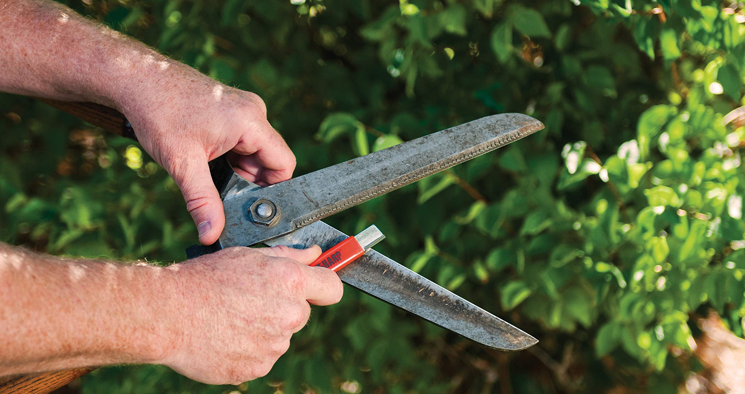 Micro 100 KS-1 orange sharpener in use for on-the-go sharpening.