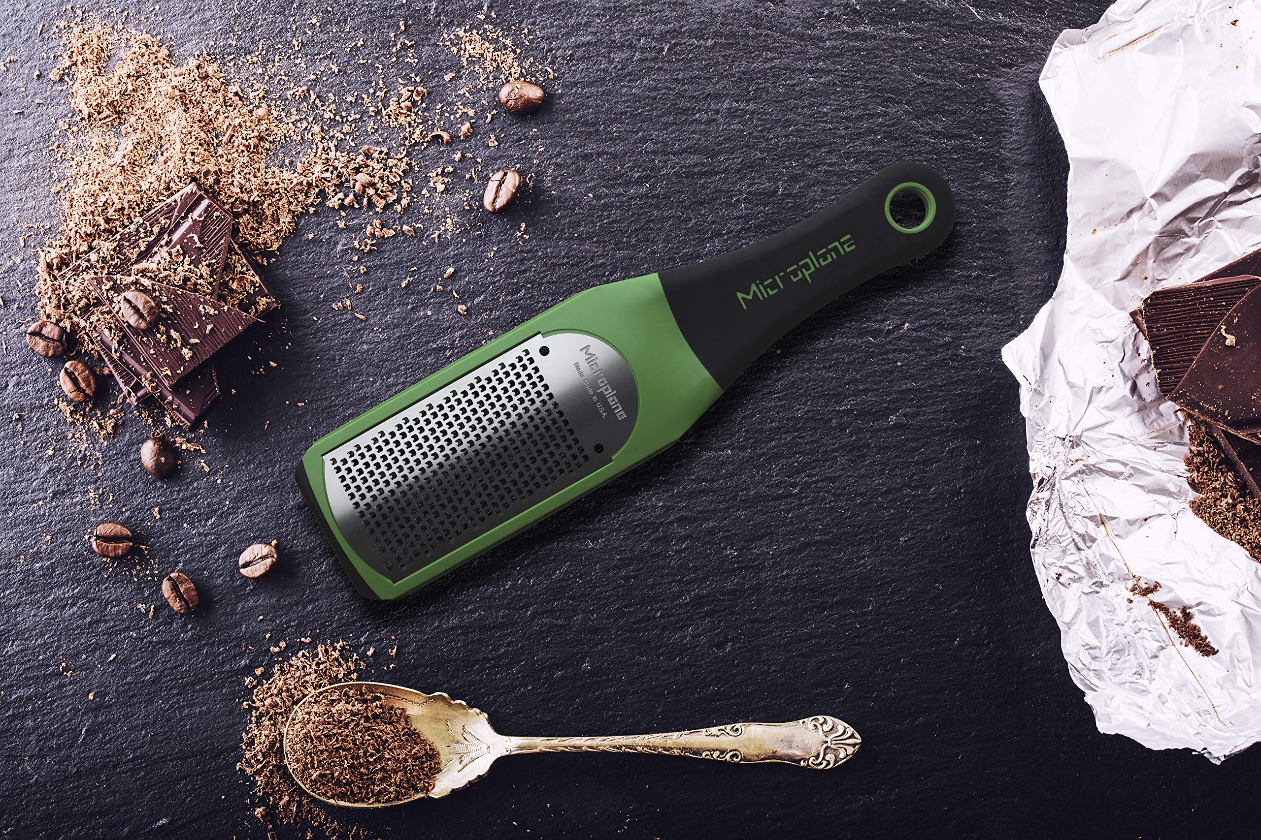 Microplane Artisan zester in green ready to zest citrus.