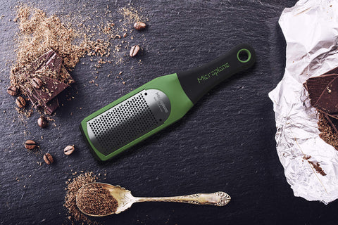 Microplane Artisan zester in green ready to zest citrus.