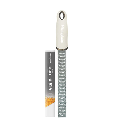 Microplane cashmere beige zester citrus blade captures zest for bright vinaigrettes and pastries.