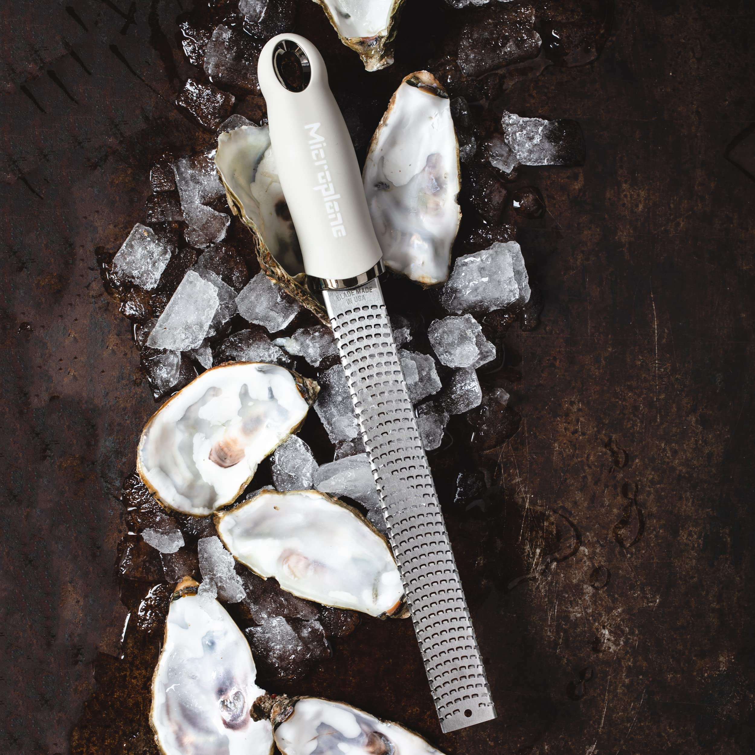 Microplane cashmere beige zester magnetic blades stay organized on a knife strip.
