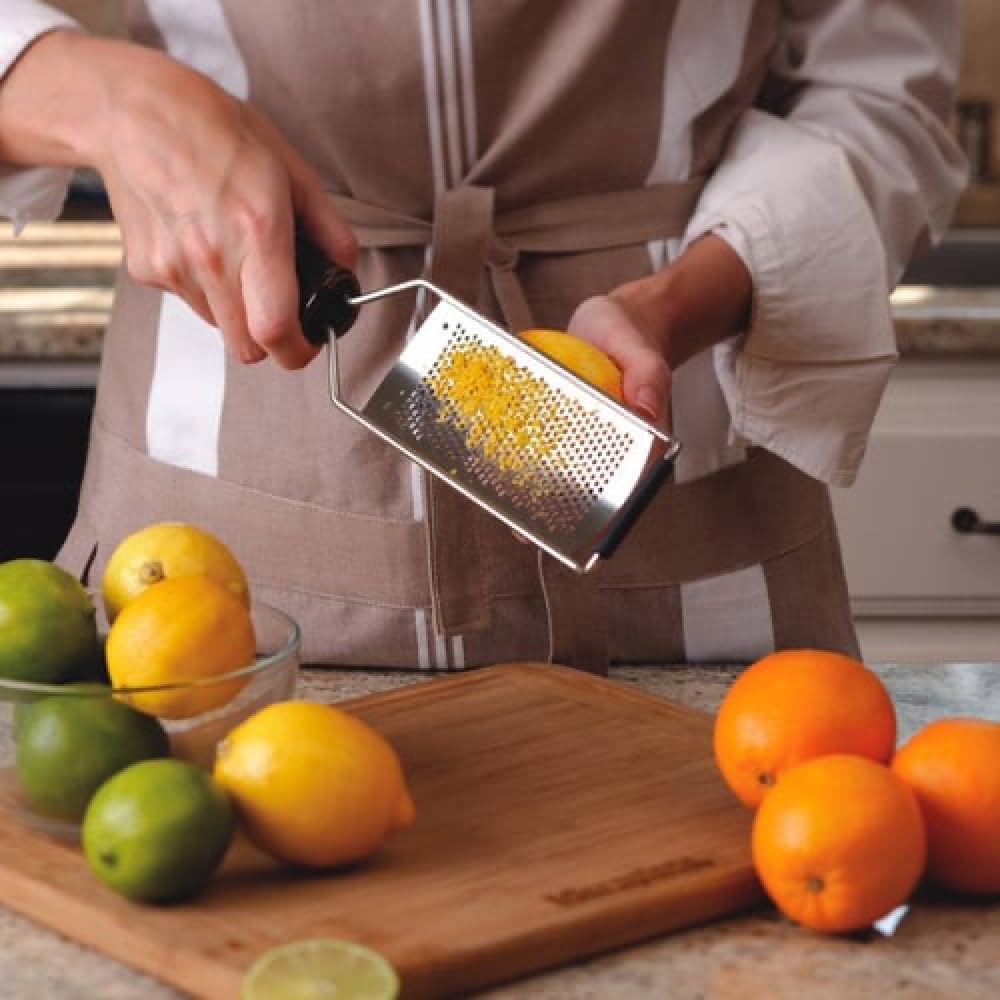 Microplane Gourmet Series grater dusting fine cheese onto pasta