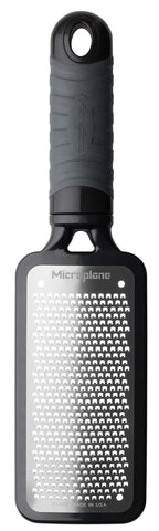 Microplane Home Series fine cheese grater in black with soft-touch handle for fine grating.