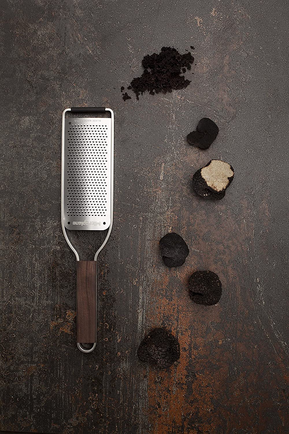 Microplane Master Series wood handle ergonomic grip for comfortable extended use.