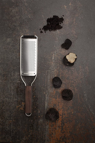 Microplane Master Series wood handle ergonomic grip for comfortable extended use.