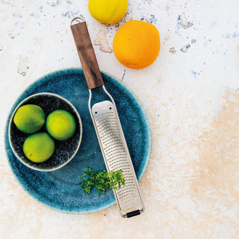 Microplane Master Series zester in use over citrus for zest