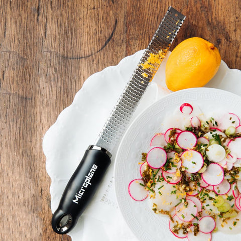 Microplane Premium Classic Zester mounted on magnetic strip for easy storage.