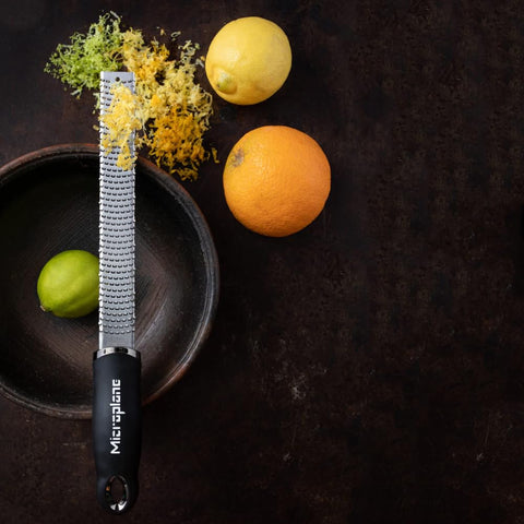 Microplane Premium Classic Zester blade detail shows ultra-sharp, surgical-grade stainless steel.