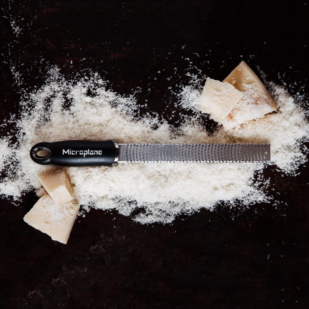 Microplane Premium Classic Zester shaving nutmeg or cinnamon for warm baking notes.