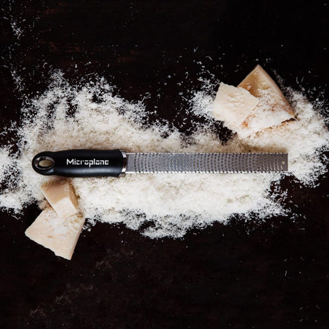 Microplane Premium Classic Zester shaving nutmeg or cinnamon for warm baking notes.