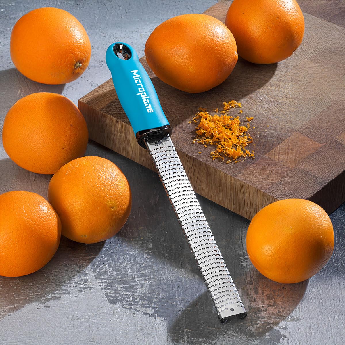 Microplane Premium Classic turquoise dishwasher-safe tool for easy cleanup after cooking.
