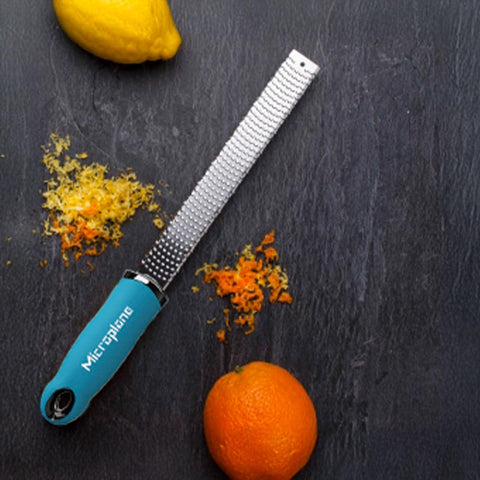Microplane Premium Classic turquoise grater-handle ideal for grating ginger and garlic into fresh pastes.