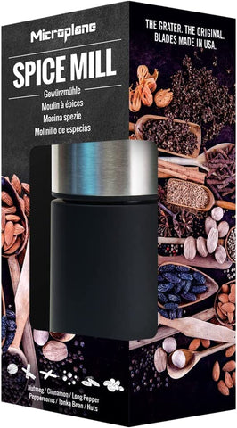 Microplane Spice Mill base shows spices ready to grate for flavor.