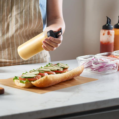 MIGHTY STRONG dishwasher-safe bottles simplify cleanup after cooking and serving.