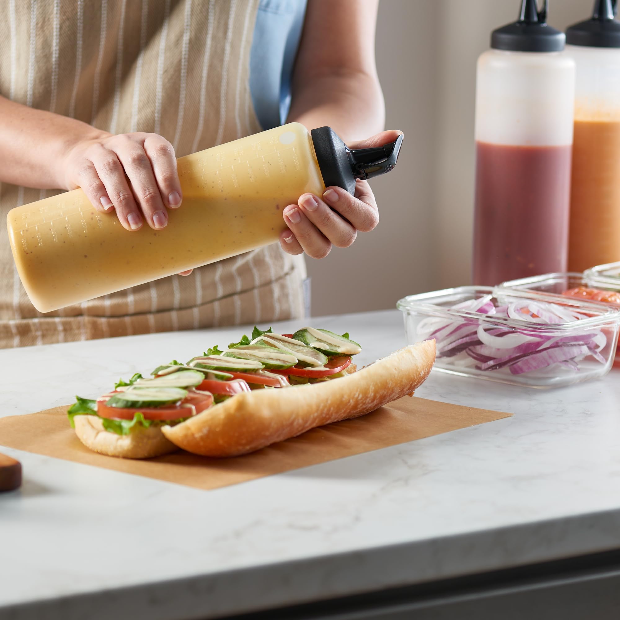 MIGHTY STRONG bottles include measurement markings for precise dosing in recipes